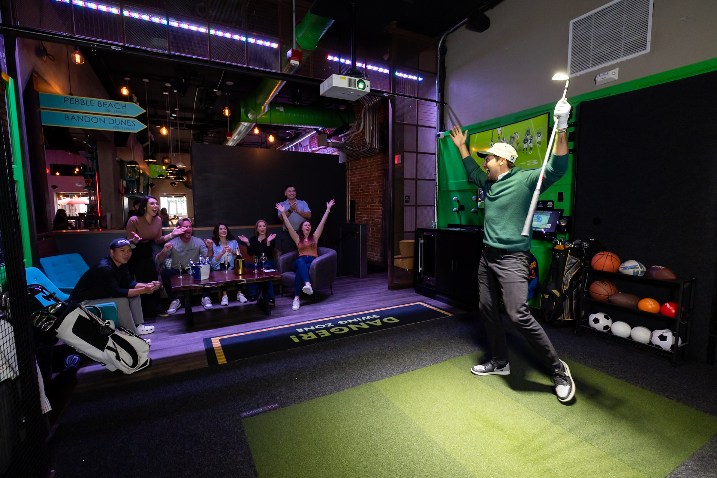 Player celebrating a shot in an Evenplay sim bay